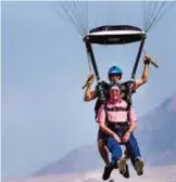  ??  ?? Wendell Ashcroft and his tandem instructor Scotty Freeland prepare to land at Skydive Ogden.