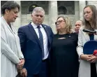  ?? ROBERT KITCHIN/STUFF ?? Police Minister Poto Williams, left, and National MP Mark Mitchell discuss the petition with the mother and sister of Constable Matthew Hunt.