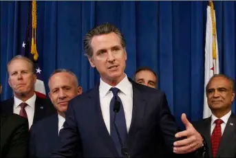  ??  ?? in this march 20 file photo, Gov. Gavin Newsom, center, discusses the homeless problem facing California after a meeting with the mayors of some of the state’s largest cities held at the Governor’s office in sacramento, Calif.
AP Photo/RIch PedRoncell