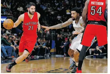  ?? David Zalubowski/the associ ated press ?? Raptors guard Greivis Vasquez works a ball past Nuggets forward Wilson Chandler Sunday.