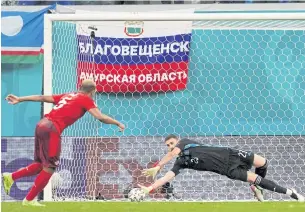  ??  ?? THE SAVIOUR: Spain goalkeeper Unai Simon, right, saves a kick by Switzerlan­d’s Manuel Akanji in a penalty shoot-out.