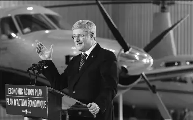  ?? Mark Blinch, Reuters ?? Prime Minister Stephen Harper, shown making an announceme­nt at Toronto City Airport on Friday, says an Air Canada shutdown due to labour disruption­s during the busy March break would be unacceptab­le.