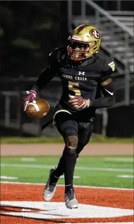  ?? PHOTOS BY JASON GETZ FOR THE AJC ?? Johns Creek receiver Josh Thompson, reacting after a TD reception against Riverwood on Sept. 24, had two TD receptions in a 57-0 victory over Chattahooc­hee on Friday. Thompson also blocked a punt, his sixth blocked kick of the season.