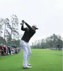  ?? —AFP ?? AUGUSTA: Rory McIlroy of Northern Ireland plays his shot from the 14th tee during a practice round prior to the start of the 2017 Masters Tournament at Augusta National Golf Club yesterday in Augusta, Georgia.