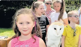  ??  ?? Owl Be Seeing You Ava Young met Cuddles the barn owl