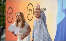  ??  ?? Former Secretary of State Hillary Rodham Clinton (right) waves to the crowd before a conversati­on with Laurene Powell Jobs at OZY Fest in Central Park on Saturday, in New York. Photo by EVan agoStInI/ InVISIon/aP