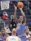  ??  ?? Carlos Osorio / Associated Press New York Knicks forward Julius Randle takes a shot against the Detroit Pistons.