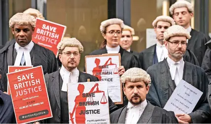  ?? ?? Barristers from the Criminal Bar Associatio­n on their first day of strike action this week.