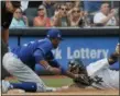  ?? JULIE JACOBSON — THE ASSOCIATED PRESS ?? New York Yankees’ Gleyber Torres, right, is tagged out by Kansas City Royals third baseman Alcides Escobar (2) as he attempts to stretch a double into a triple during the seventh inning of a baseball game, Saturday in New York.