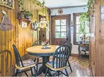  ?? PHOTOS BY PERRY MASTROVITO / MONTREAL GAZETTE ?? The round cherry wood dining table sits on a large and heavy turned wooden base with extended legs.