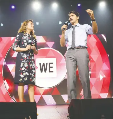  ?? MONICA SCHIPPER / GETTY IMAGES FOR WE DAY FILES ?? Sophie Grégoire Trudeau and Prime Minister Justin Trudeau on stage at the WE Day UN at The Theater in 2017. The
prime minister has apologized for taking part in a cabinet decision on WE and a $900-million grant program.
