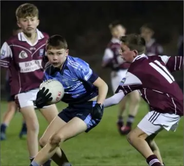  ??  ?? Páidí Doyle of Rathangan evades the challenge of Piercestow­n’s James Hegarty.