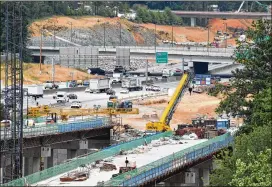  ?? HYOSUB SHIN / HYOSUB.SHIN@AJC.COM ?? The I-285/Ga. 400 junction in Sandy Springs will feature “flyover” ramps and lanes adjacent to both roads and will be nearly as big as Spaghetti Junction.