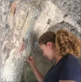  ??  ?? A volunteer at work in a cave church