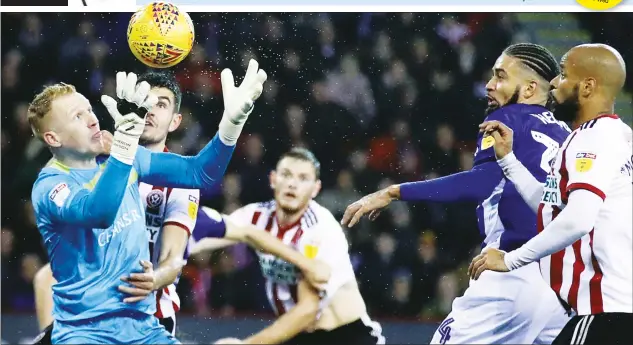  ?? PICTURE: PA Images ?? IT’S MINE: Sheffield Wednesday goalkeeper Cameron Dawson makes a save