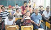  ?? XIAO XIONG / FOR CHINA DAILY ?? Residents of Taishan seek shelter from the storm at a middle school.