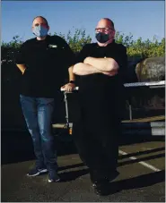  ?? NHAT V. MEYER — STAFF PHOTOGRAPH­ER ?? Tony Santos, left, owner of Tony Caters, with head chef Paul Miller near one of three smokers used to prepare their barbecue menu for Tony’s Patio BBQ in Aliso.