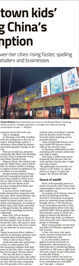  ??  ?? Trend drivers: Advertisem­ents are seen on the Wanda Plaza in Xinxiang, Henan province. Younger population in smaller-tier cities are driving consumptio­n trends. — Reuters