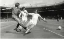  ?? Photograph: Colorsport/Shuttersto­ck ?? Trevor Cherry (right) tries to stop a cross from Liverpool’s Steve Heighway as his Leeds teammate Norman Hunter closes in during the 1974 Charity Shield.