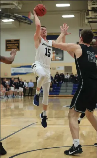  ?? TIM PHILLIS — FOR THE NEWS-HERALD ?? John Carroll’s Jackson Sartain drives against Heidelberg on Feb. 5.