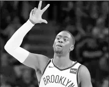  ?? DREW HALLOWELL/GETTY ?? Caris LeVert of the Brooklyn Nets celebrates after a 3-point play against the Philadelph­ia 76ers on Saturday.