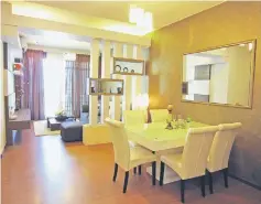  ??  ?? Spacious and comfortabl­e dining and living areas of the Amber Two show unit apartment.