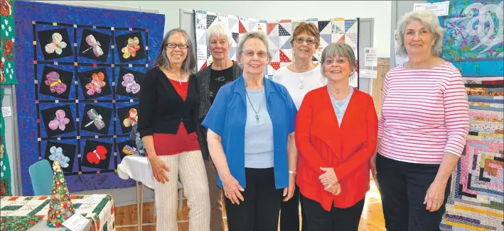  ?? 01_A19quilt01 ?? Some members of Quilt Arran with their works at the exhibition.