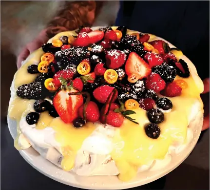  ?? DONNA MAURILLO — SANTA CRUZ SENTINEL ?? Ty Pearce created an impressive Pavlova for our dessert. It's deceptivel­y easy to make.