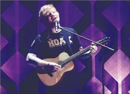  ?? JOHN SALANGSANG / INVISION / AP ?? Singer Ed Sheeran performs Dec. 1 at Jingle Ball at The Forum in Inglewood, Calif. Sheeran’s “Shape of You” has been on the Hot 100 since it was released Jan. 6 and topped Billboard’s year-end singles chart.