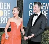  ?? JON KOPALOFF/GETTY ?? Scarlett Johansson and Colin Jost walk the red carpet at the Golden Globe Awards on Sunday.