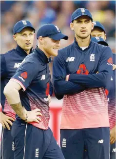  ?? — Reuters ?? England’s Ben Stokes and Alex Hales wait for a review after Adil Rashid runs out West Indies’ Chris Gayle during the third ODI in Brightside Ground, Bristol.