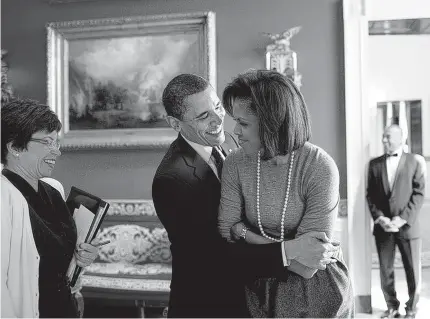  ??  ?? In this 2009 photo by Pete Souza, President Barack Obama is shown with first lady Michelle Obama in the White House Red Room.