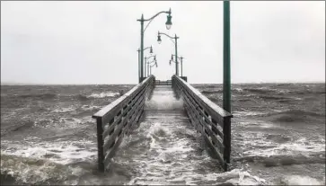  ?? Adam DelGiudice AFP/Getty Images ?? A WALKWAY f loods in Jensen Beach, Fla., as Hurricane Dorian approached the region last week.