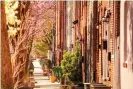  ??  ?? A Baltimore neighborho­od is lined with brick houses and trees. Photograph: Sergey Novikov/Alamy Stock Photo