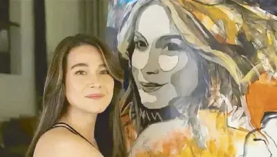 ?? ?? Bea Alonzo with her portrait by Isaac Sion