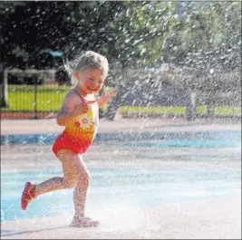  ?? K.M. Cannon ?? Las Vegas Review-journal @Kmcannonph­oto Summer Rae Smith, 3, of Henderson plays on the splash pad at Paseo Vista Park.