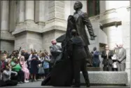  ?? MATT ROURKE — THE ASSOCIATED PRESS ?? Philadelph­ia Mayor Jim Kenney, center, and sculptor Branly Cadet unveil a statue of Octavius Valentine Catto at City Hall in Philadelph­ia, Tuesday, Sept. 26, 2017. Born in 1839, Catto led a civil rights movement in Philadelph­ia a century before the...