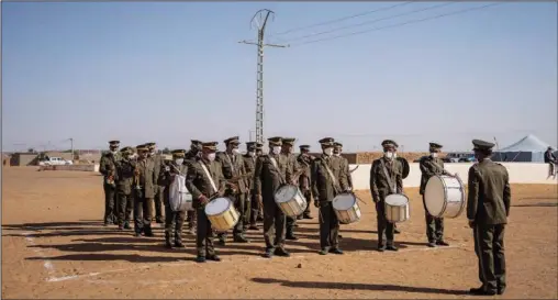  ?? (AP/Bernat Armangue) ?? A Polisario Front military orchestra performs Tuesday during a National Unity Day event in the Dajla refugee camp in Algeria.