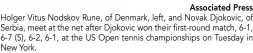  ?? Associated Press ?? Holger Vitus Nodskov Rune, of Denmark, left, and Novak Djokovic, of Serbia, meet at the net after Djokovic won their first-round match, 6-1, 6-7 (5), 6-2, 6-1, at the US Open tennis championsh­ips on Tuesday in New York.