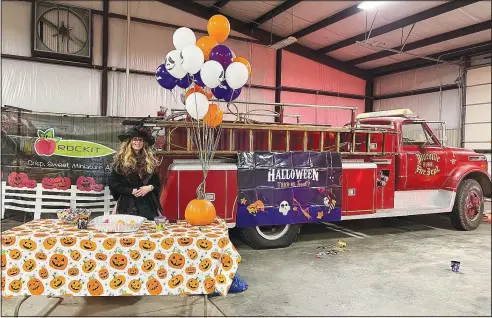  ?? ?? Chastity Derrisseau­x mans the station at the Pineville Fire Department Halloween event. Derrisseau­x said she wants the kids, and the community, to know the Fire Department is here for them. (Special to NWA Democrat-Gazette/Alexus Underwood)