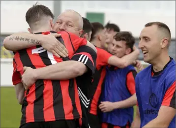  ??  ?? Gorey Rangers manager Shane Dunbar hugs Killian Cushe.