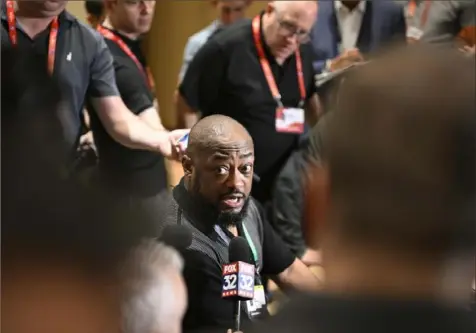  ?? Phelan M. Ebenhack/Associated Press ?? Steelers head coach Mike Tomlin talks with reporters during an AFC coaches availabili­ty at the NFL owners meetings on Monday in Orlando, Fla.