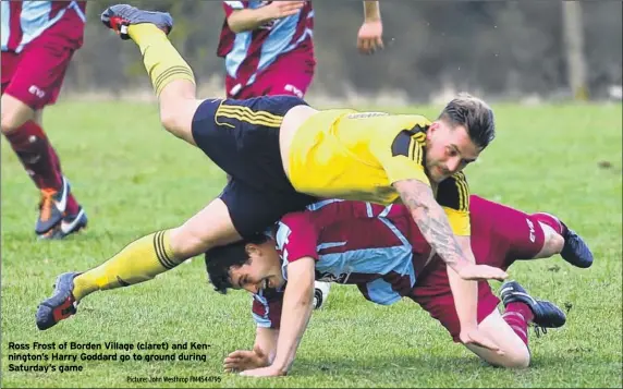  ?? Picture: John Westhrop FM4544795 ?? Ross Frost of Borden Village (claret) and Kennington’s Harry Goddard go to ground during Saturday’s game