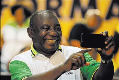  ?? Themba Hadebe ?? The Associated Press Newly elected African National Congress President, Cyril Ramaphosa takes a selfie Monday at the party’s elective conference in Johannesbu­rg.