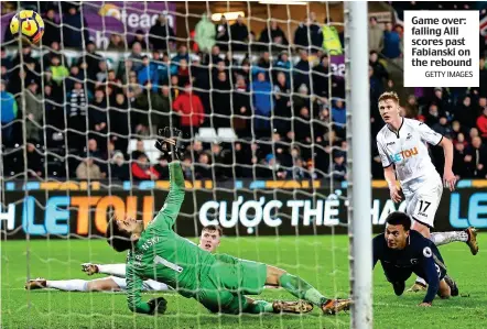  ?? GETTY IMAGES ?? Game over: falling Alli scores past Fabianski on the rebound