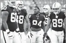  ?? AP Photo ?? Oakland Raiders’ Antonio Brown (84) and teammates gather before an NFL preseason game Aug. 22 against the Green Bay Packers in Winnipeg, Manitoba.
