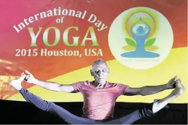  ?? Mayra Beltrán / Houston Chronicle ?? Robert Bustany, 67, who has practiced yoga for 55 years, demonstrat­es his techniques during the Internatio­nal Day of Yoga. The event, organized by the Consul General of India, brought together a diverse group of cultural organizati­ons and yoga...