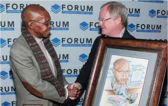  ??  ?? Hugo Redelinghu­ys (right), newly elected executive chairperso­n of the FCJ, presented Joe Thloloe, current chairperso­n of the panel of judges for the FCJ Excellence Awards, with a framed cartoon of Thloloe honouring him with lifelong membership of the...