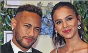  ??  ?? Neymar Junior and his girlfriend Bruna Marquezine, arrive to participat­e in the charity auction for the Neymar Jr. Institute in Sao Paulo.