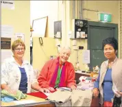  ??  ?? Finley Hospital Auxiliary Shop volunteers Janet Delmenico and Leslie Wilson with Estelita Cole.